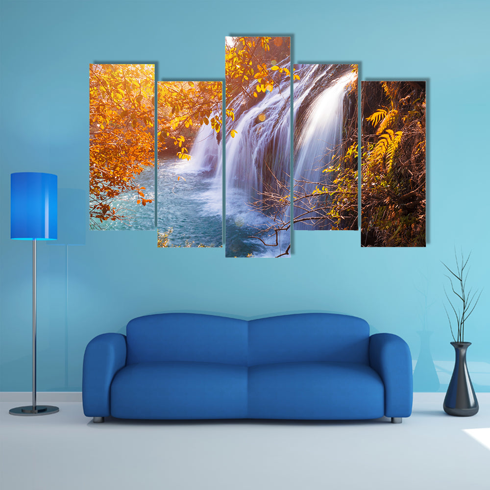 Autumn Waterfall with Sunlit Foliage Canvas Wall Art