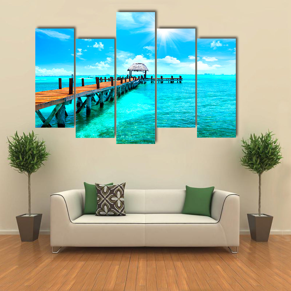 Sunlit Wooden Pier and Thatched Hut Canvas Wall Art