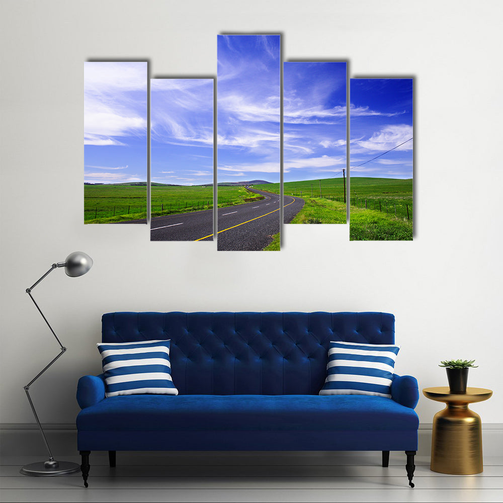 Winding Road Through Green Fields Canvas Wall Art