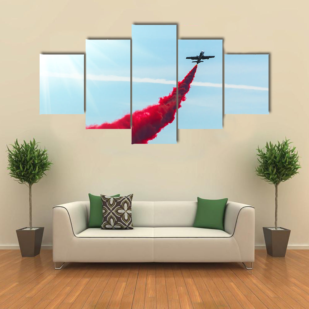 Airplane fly With Red Trail Smoke Canvas Wall Art