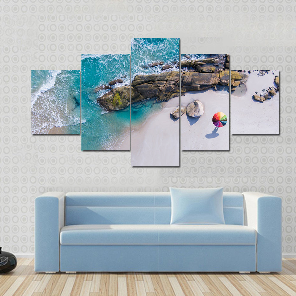 Umbrella On The Beach And Foam Of Sea Wave Canvas Wall Art