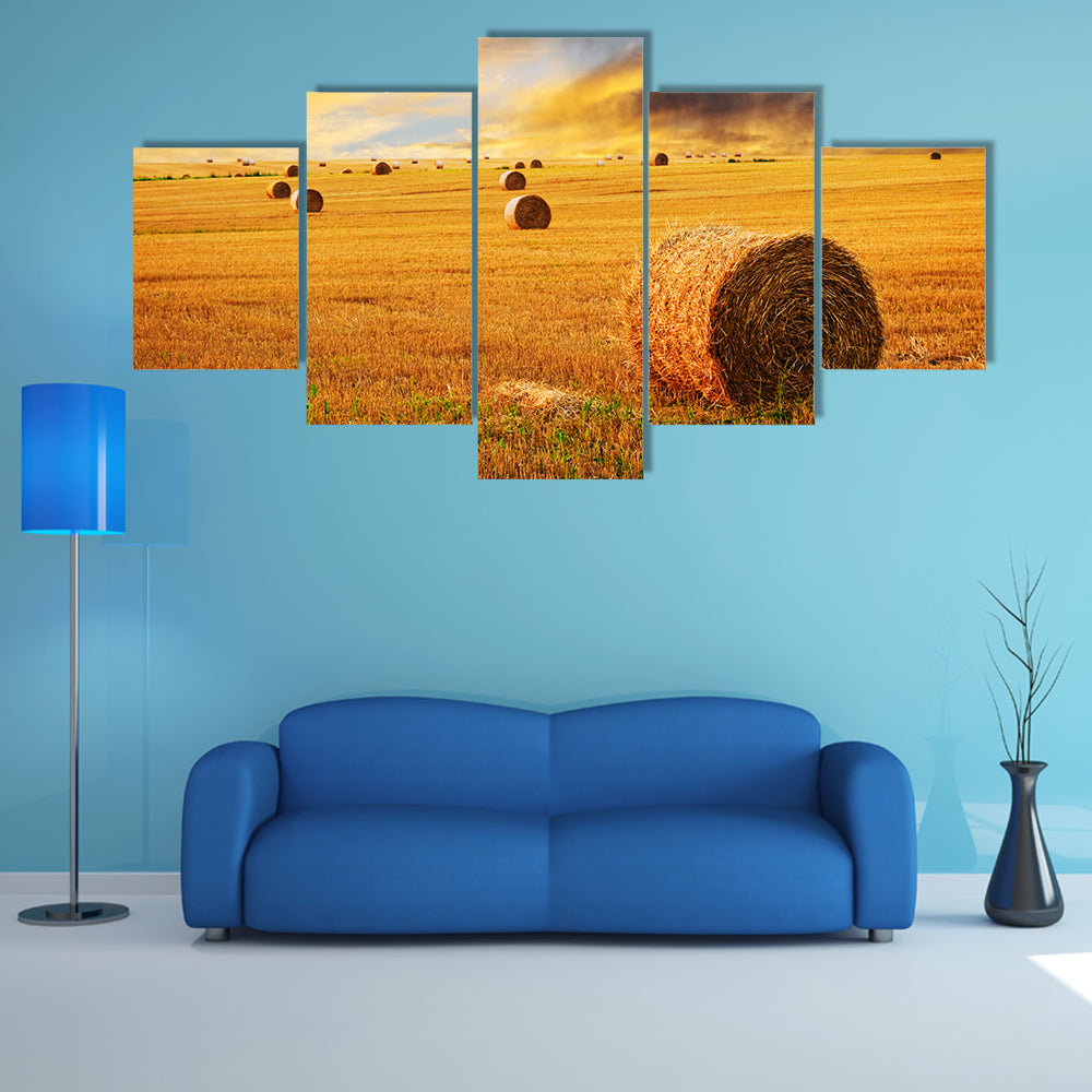 Golden Sunset Over Farm Field With Hay Bales Canvas Wall Art
