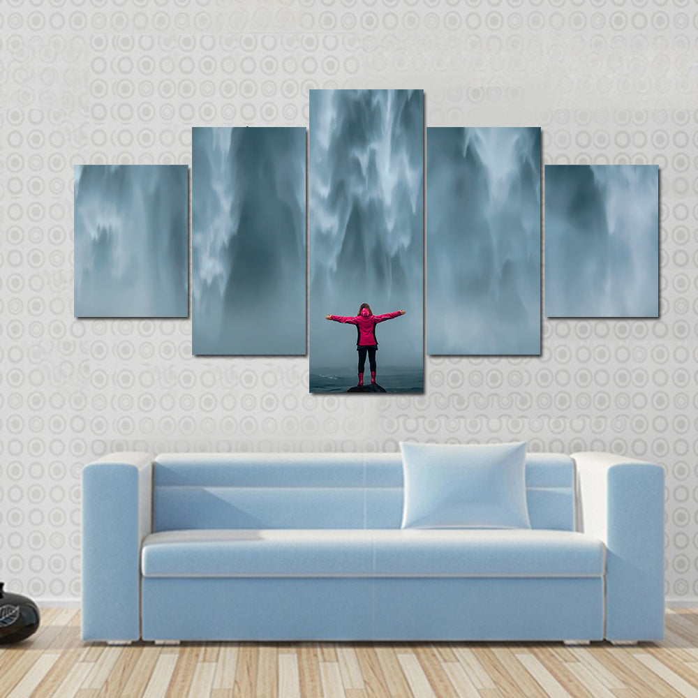 Girl Against Skogafoss Waterfall At South Iceland Canvas Wall Art
