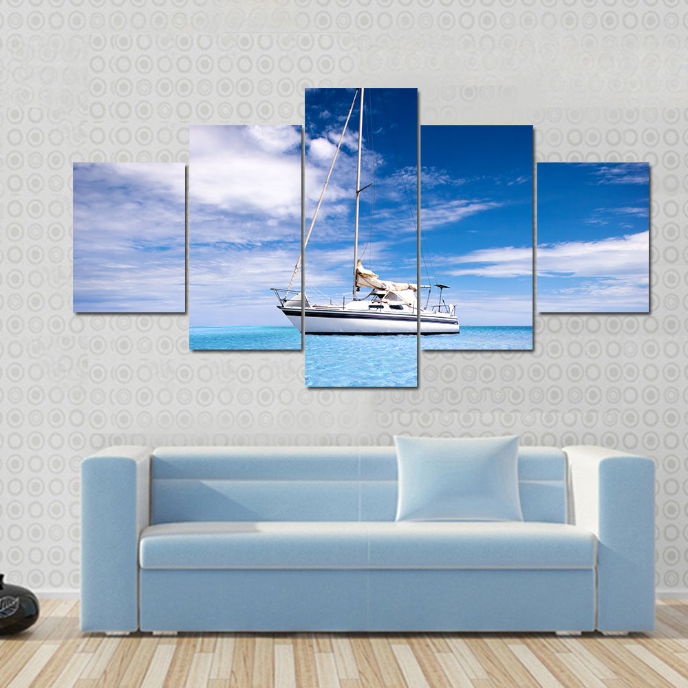 Single-masted White Sailboat on Turquoise Water Canvas Wall Art