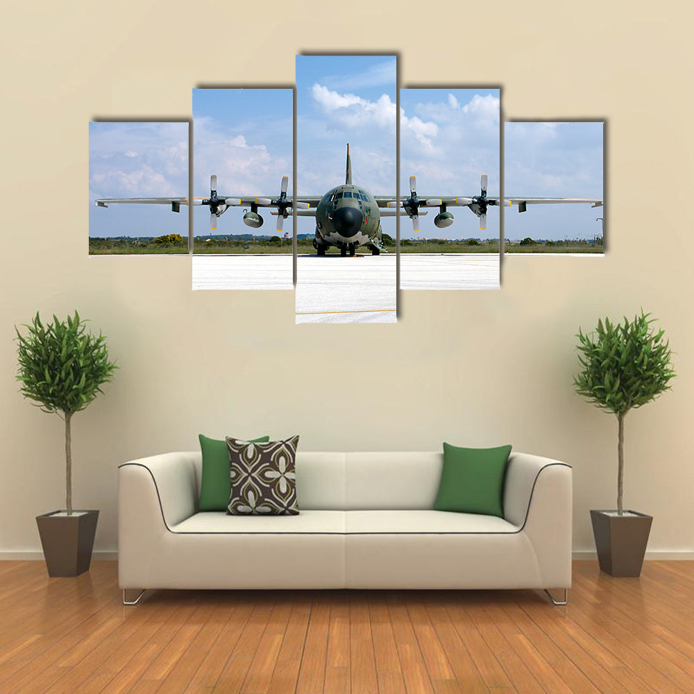 Military Airplane Parked At An Airbase Canvas Wall Art