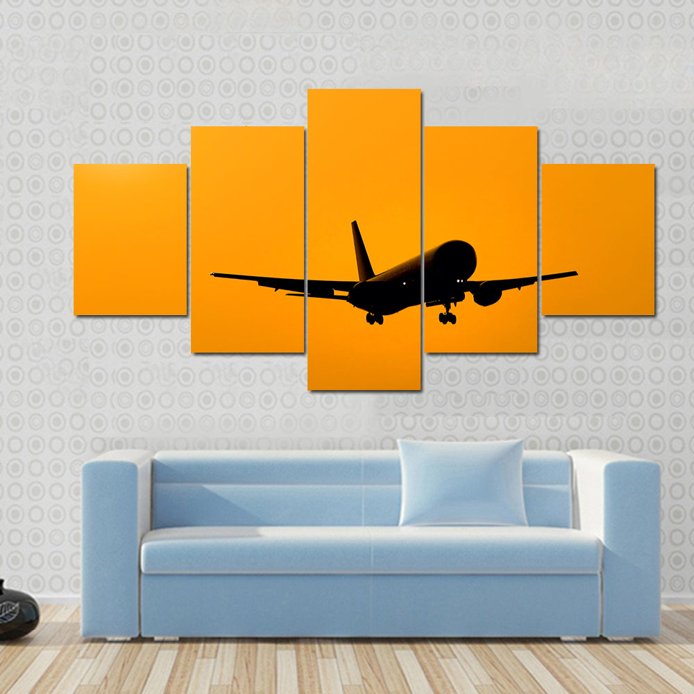 Aircraft Landing At Sunset Canvas Wall Art