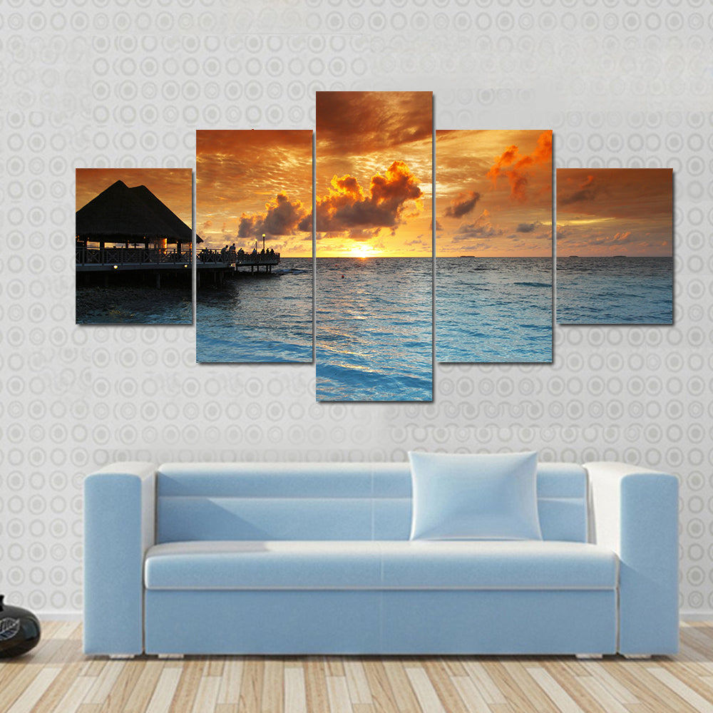 Maldives Thatched Hut on Pier at Sunset Canvas Wall Art