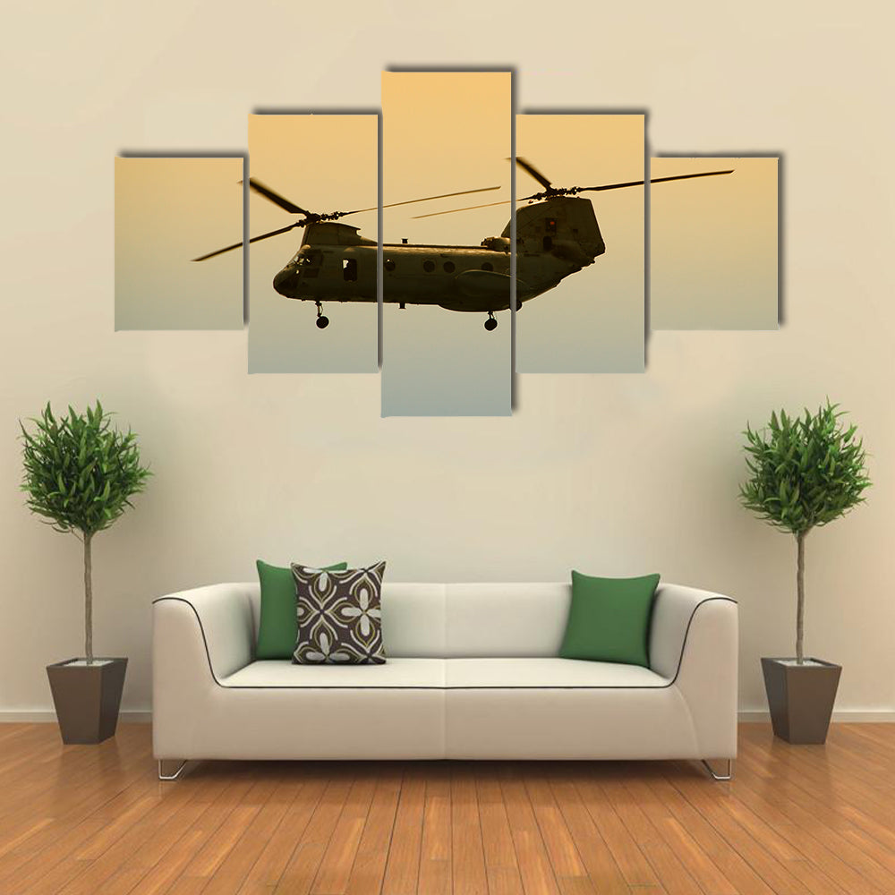 Military Cargo Helicopter In Flight At Dawn Canvas Wall Art