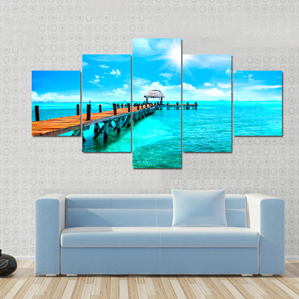 Sunlit Wooden Pier and Thatched Hut Canvas Wall Art