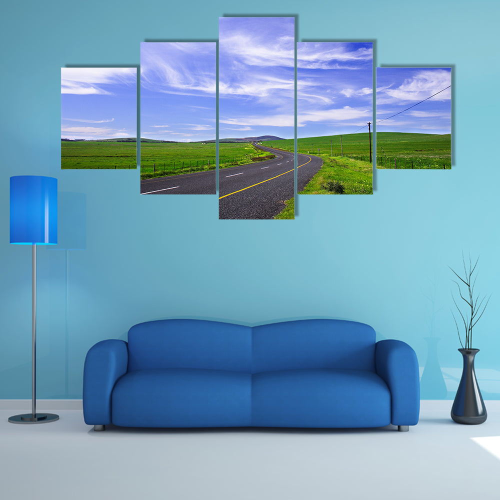 Winding Road Through Green Fields Canvas Wall Art