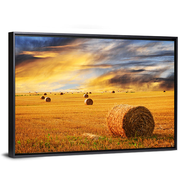 Golden Sunset Over Farm Field With Hay Bales Canvas Wall Art