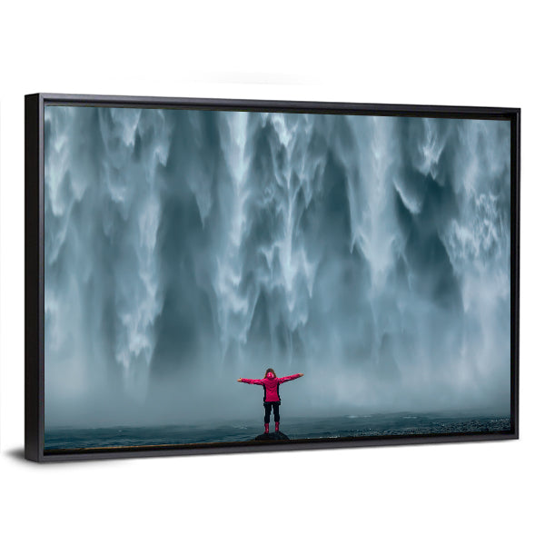 Girl Against Skogafoss Waterfall At South Iceland Canvas Wall Art