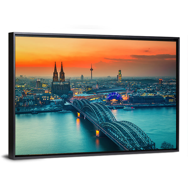 Cologne Cathedral And Hohenzollern Bridge At Night In Germany Canvas Wall Art in gray, orange and yellow, framed canvas, product view on a white background