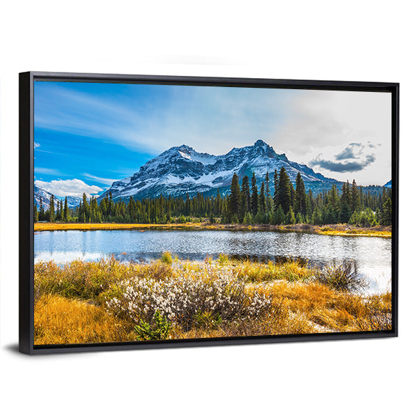 Snowy Rocky Mountains Lake Reflection Canvas Wall Art in yellow, green and blue, framed canvas, product view on a white background