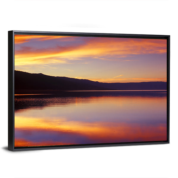 Wispy Clouds Over Lake at Sunset Canvas Wall Art in orange, yellow and purple, framed canvas, product view on a white background