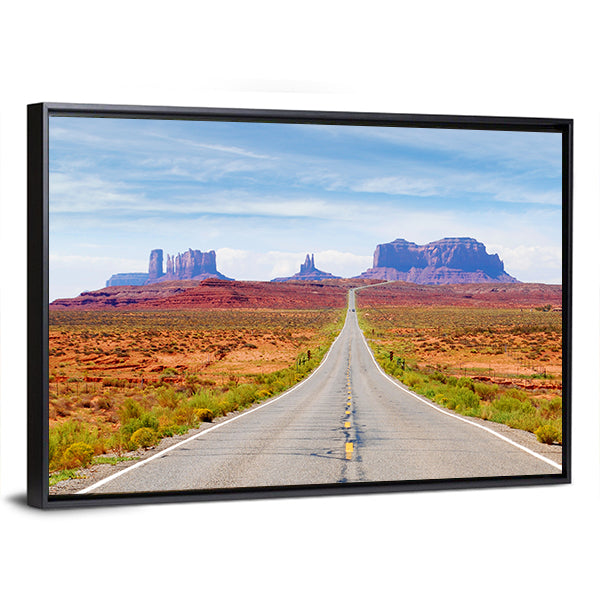U.s. Route 163 Through Monument Valley Canvas Wall Art in gray, orange and blue, framed canvas, product view on a white background
