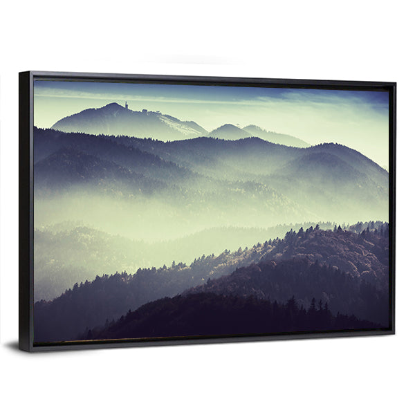 Misty Mountain Valley with Tower Silhouette Canvas Wall Art in gray, green and blue, framed canvas, product view on a white background