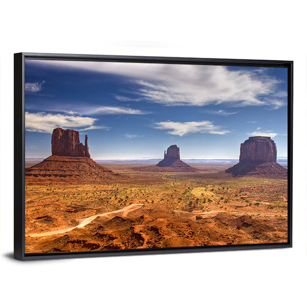 Monument Valley Buttes in Warm Desert Light Canvas Wall Art in brown, orange and blue, framed canvas, product view on a white background