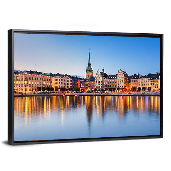 Gamla Stan In Stockholm At Evening Canvas Wall Art in orange, yellow and blue, framed canvas, product view on a white background