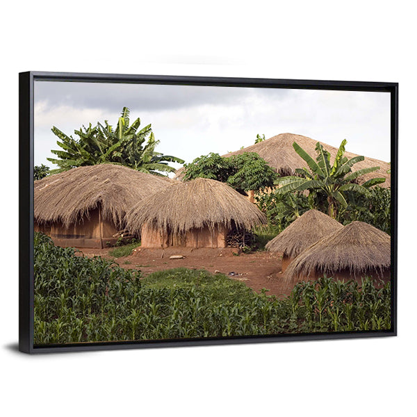 Thatched Huts In Small Village In Rural Malawi Africa Canvas Wall Art in beige, brown and green, framed canvas, product view on a white background