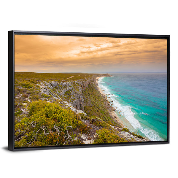 Kangaroo Island Cliffs and Turquoise Sea at Sunset Canvas Wall Art in orange, green and blue, framed canvas, product view on a white background