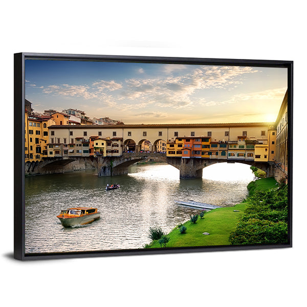 Ponte Vecchio In Florence At Sunset In Italy Canvas Wall Art in orange, yellow and blue, framed canvas, product view on a white background