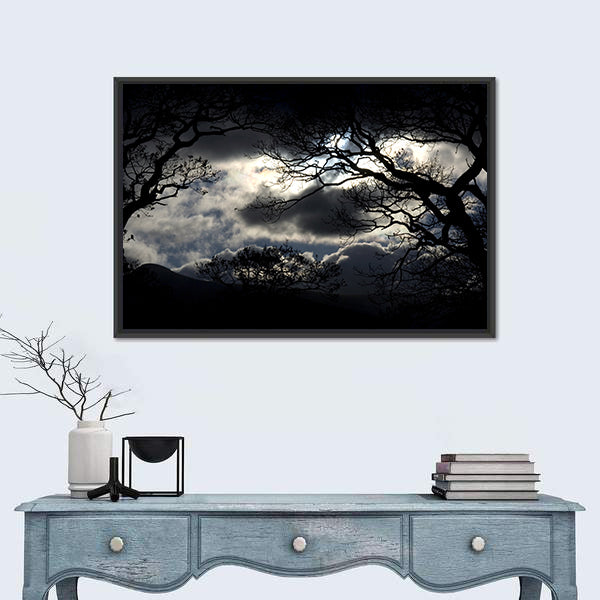 Silhouetted Trees Under Storm Clouds Canvas Wall Art