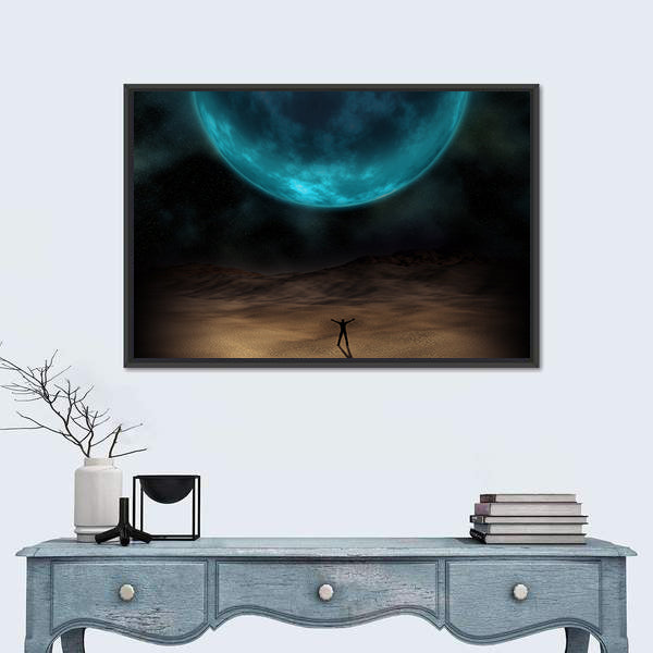 Silhouetted Figure Beneath Giant Blue Planet Canvas Wall Art