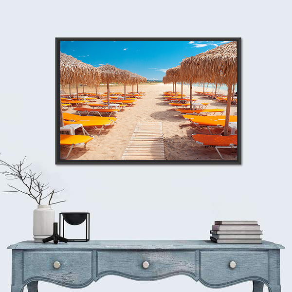 Greek Beach with Wooden Walkway and Orange Loungers Canvas Wall Art
