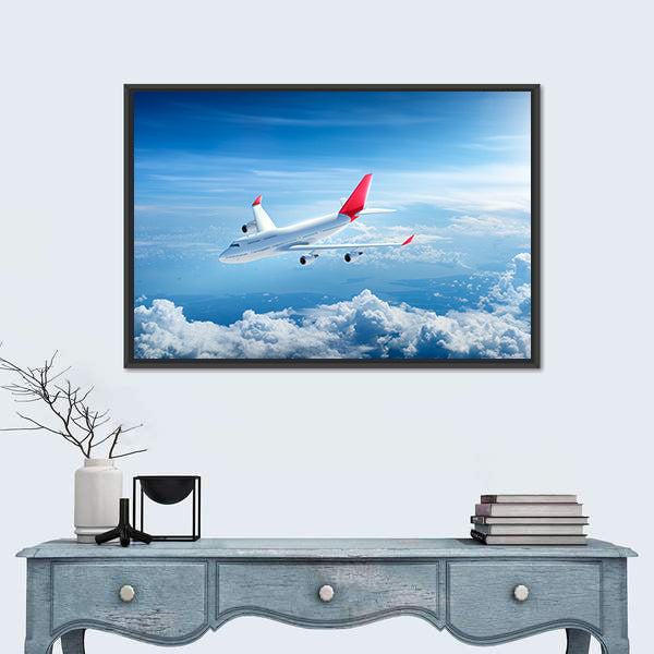 Airplane Flying Above Clouds Canvas Wall Art