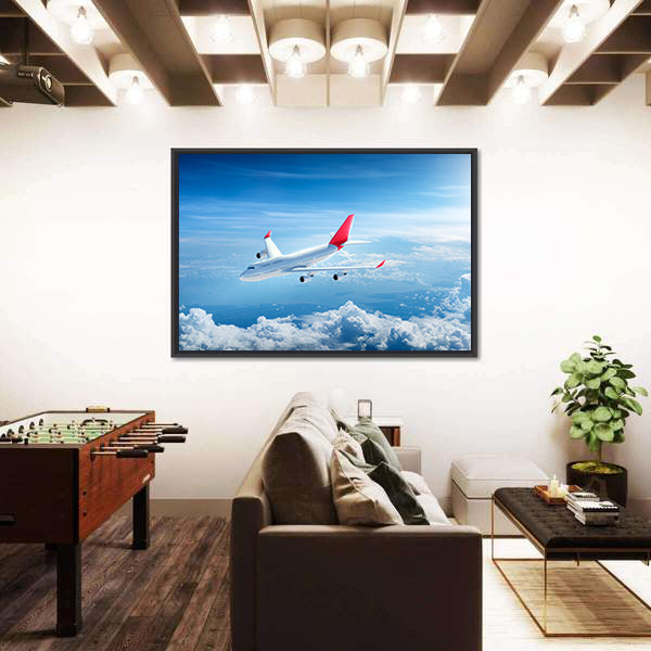 Airplane Flying Above Clouds Canvas Wall Art