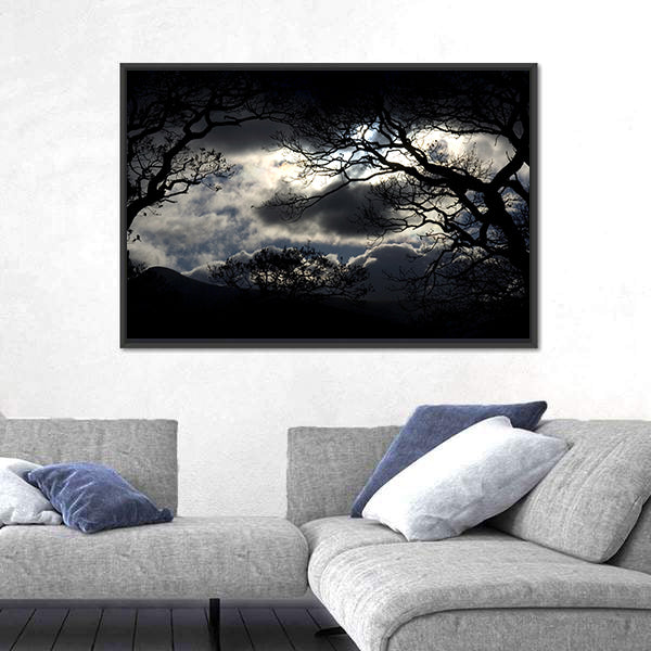 Silhouetted Trees Under Storm Clouds Canvas Wall Art