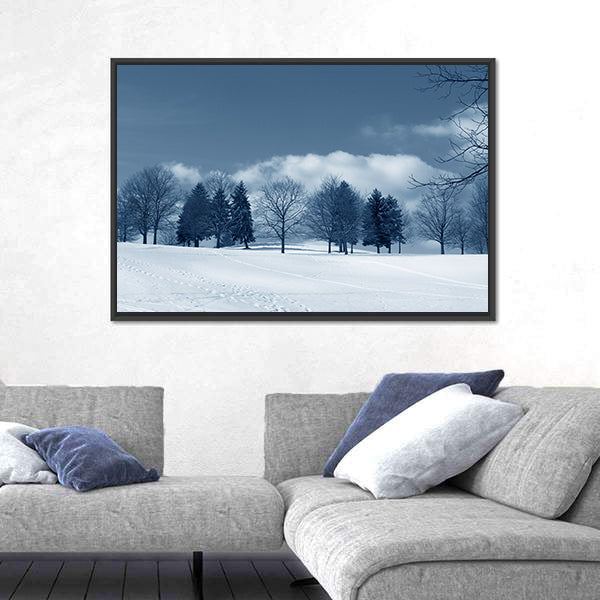 Snowy Field with Evergreens and Tracks Canvas Wall Art
