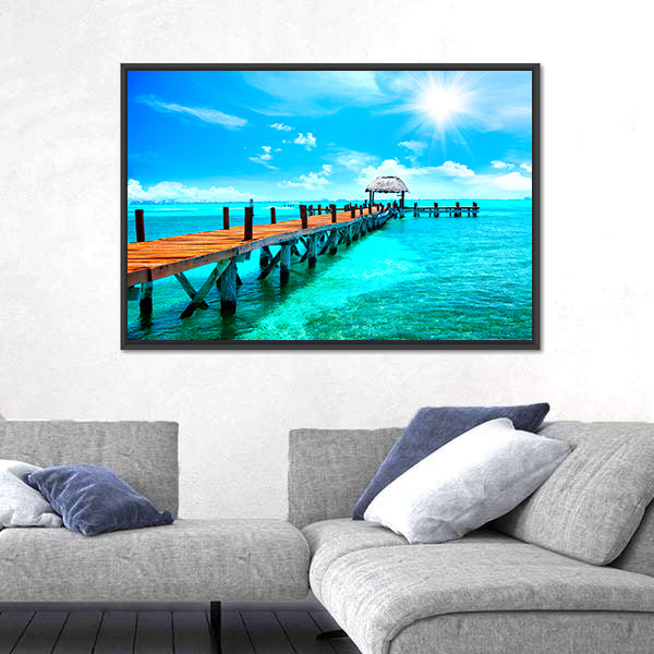 Sunlit Wooden Pier and Thatched Hut Canvas Wall Art