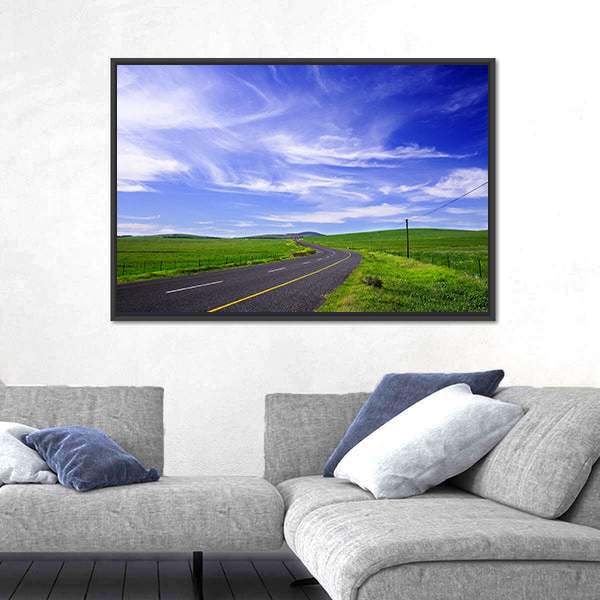 Winding Road Through Green Fields Canvas Wall Art