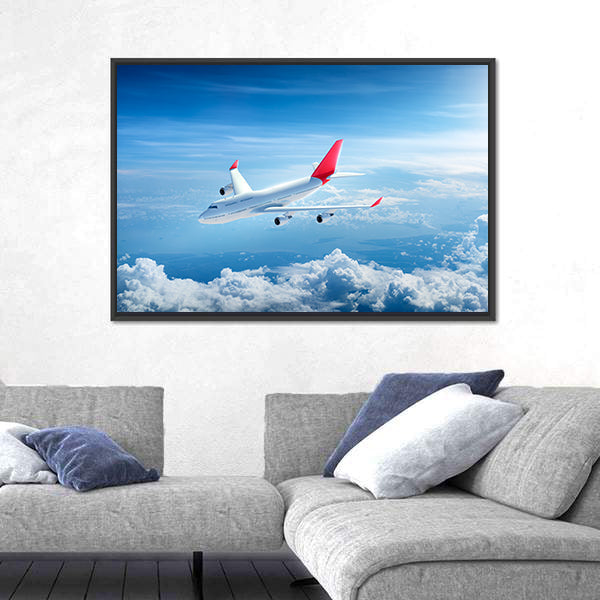 Airplane Flying Above Clouds Canvas Wall Art