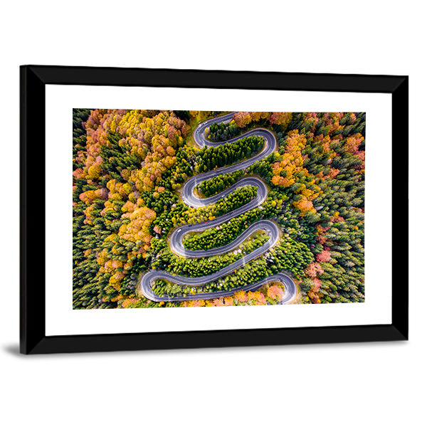 Autumn Winding Road In The Forest Canvas Wall Art in orange, yellow and green, framed print, product view on a white background