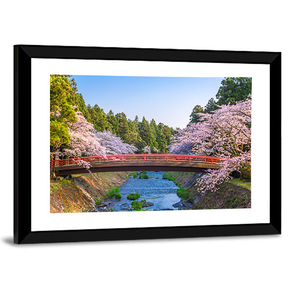 Cherry Blossoms Over Red Arched Bridge Canvas Wall Art in green, blue and pink, framed print, product view on a white background