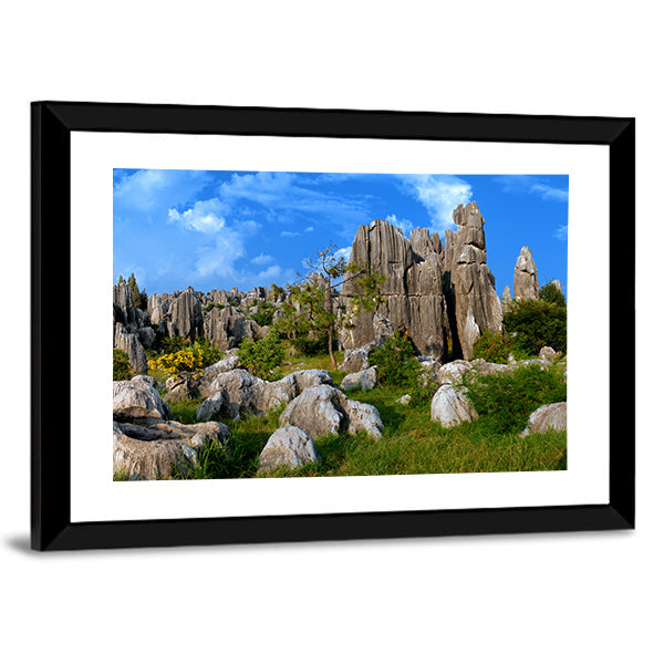 Stone Forest In Yunnan China Canvas Wall Art in gray, green and blue, framed print, product view on a white background
