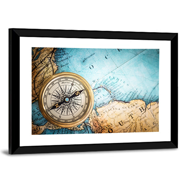 Brass Compass on Antique World Map Canvas Wall Art in brown, gold and blue, framed print, product view on a white background