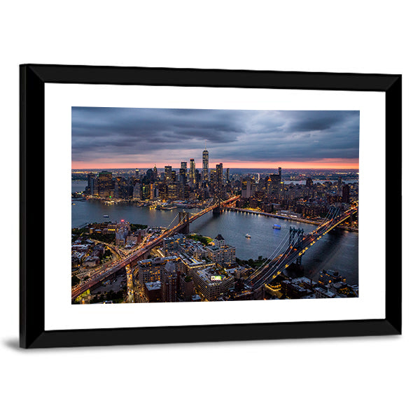 New York City at Night Canvas Wall Art in black, orange and blue, framed print, product view on a white background