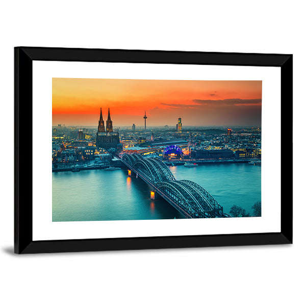 Cologne Cathedral And Hohenzollern Bridge At Night In Germany Canvas Wall Art in gray, orange and yellow, framed print, product view on a white background
