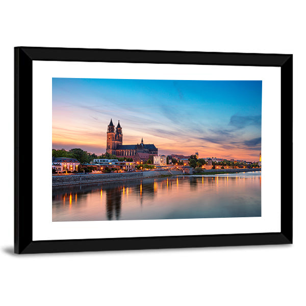 Magdeburg City And Elbe River At Sunset In Germany Canvas Wall Art in orange, yellow and blue, framed print, product view on a white background