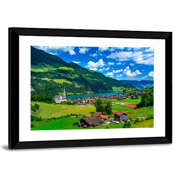 Swiss Village Lungern In Switzerland Canvas Wall Art in green and blue, framed print, product view on a white background