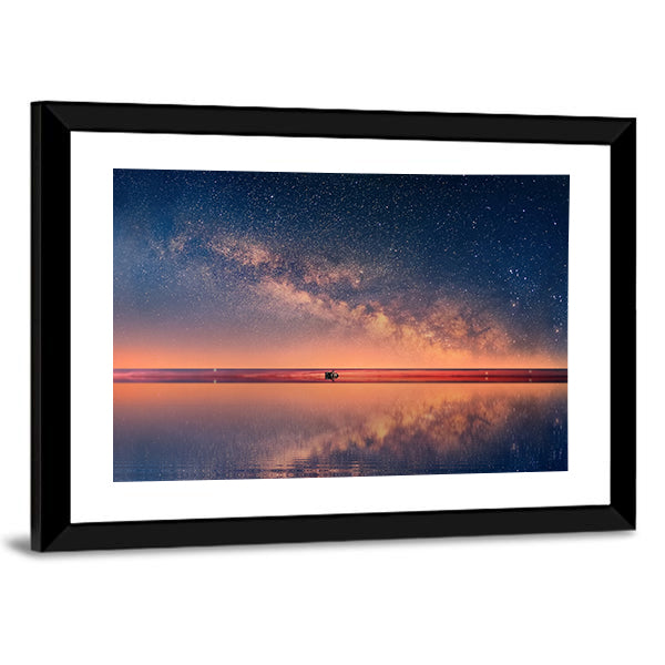 Starry Night Universe At Sea Canvas Wall Art in orange, blue and navy, framed print, product view on a white background