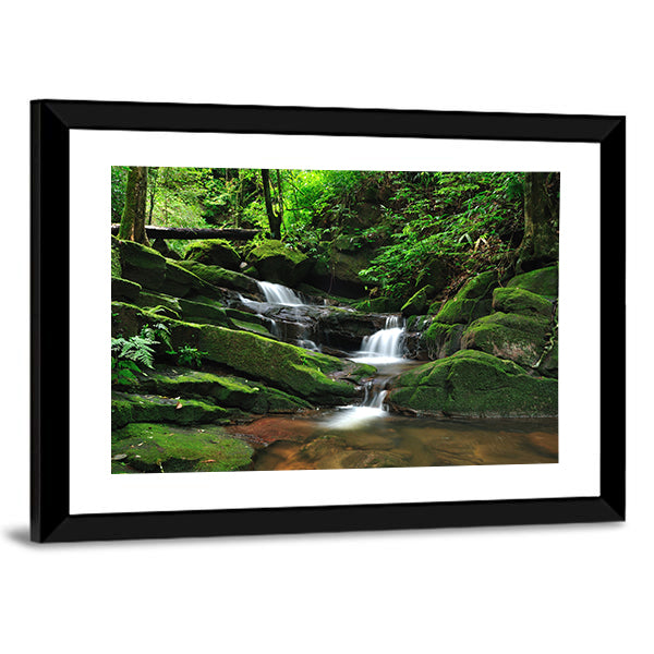 Waterfall In Rain Forest Canvas Wall Art in white, brown and green, framed print, product view on a white background