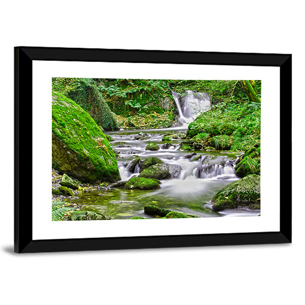 Tranquil Forest Stream And Waterfall Canvas Wall Art in white, gray and green, framed print, product view on a white background