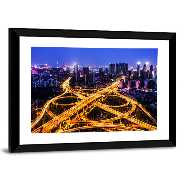 Night Traffic Interchange in Hanyang, Wuhan Canvas Wall Art in orange, yellow and blue, framed print, product view on a white background
