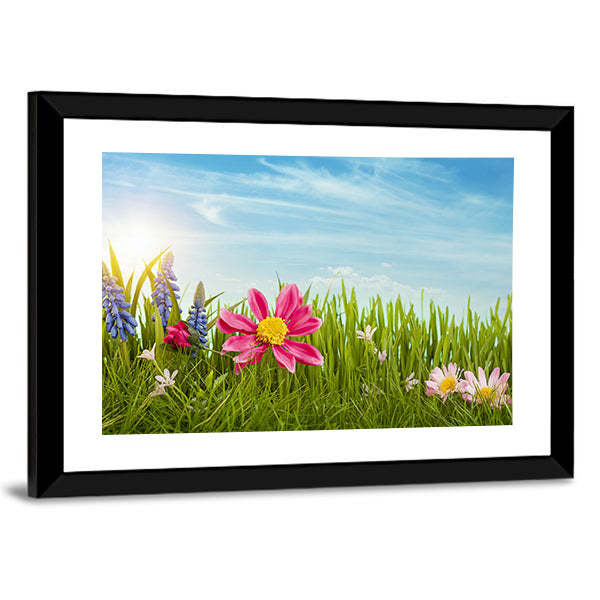 Spring Flowers Under Blue Sky Canvas Wall Art in green, blue and pink, framed print, product view on a white background