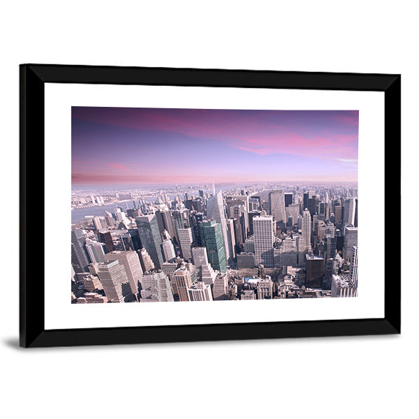 New York City Skyline at Sunset Canvas Wall Art in gray, purple and pink, framed print, product view on a white background